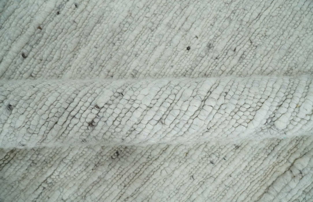 Premium Contemporary loop Pile Ivory Hand woven wool Area Rug