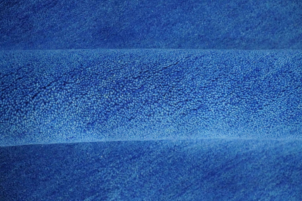 Custom made solid Blue Woolen Hand Tufted contemporary area Rug